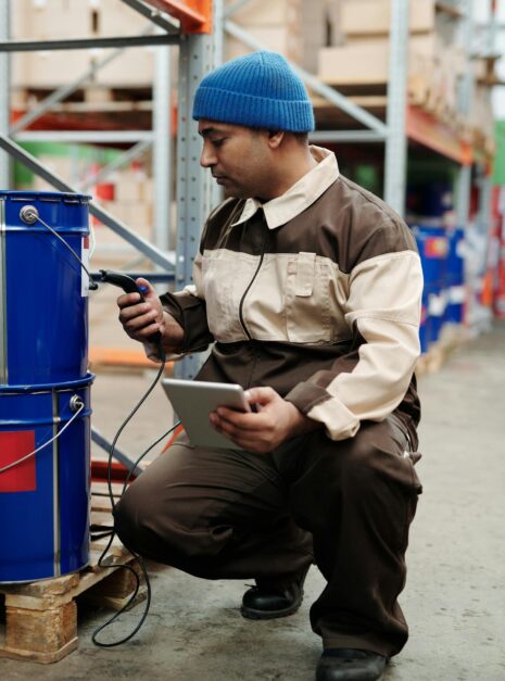 Photo by Tiger Lily Man in Brown Jacket and Blue Knit Cap
